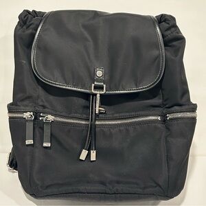 Calvin Klein Women’s black nylon backpack with silver accents, pockets